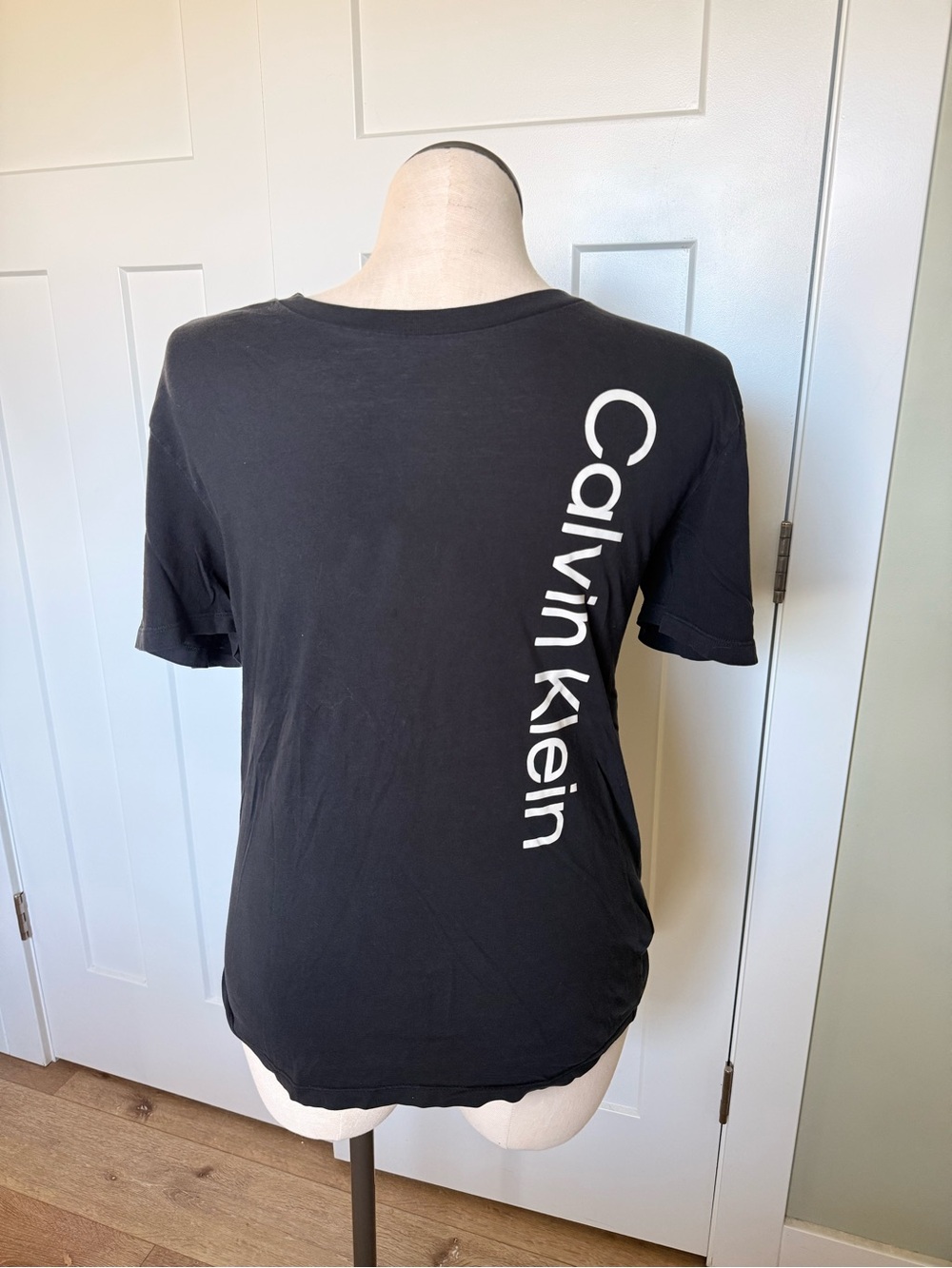Calvin Klein Black Tee with White Vertical Logo